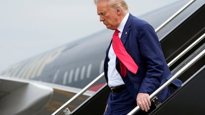 Former President Donald Trump arrives at Ronald Reagan Washington National Airport, on August 3, 2023, in Arlington, Virginia.