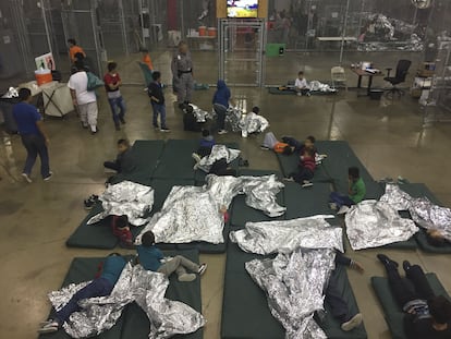 This file photo from June 17, 2018 provided by US Customs and Border Protection shows underage migrants in one of the cages at a detention center in McAllen, Texas.