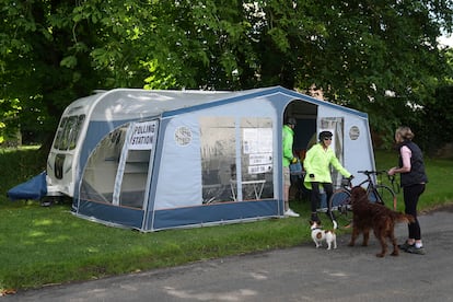 Voters cast their votes in a caravan used as a polling station in Carlton on Thursday. 