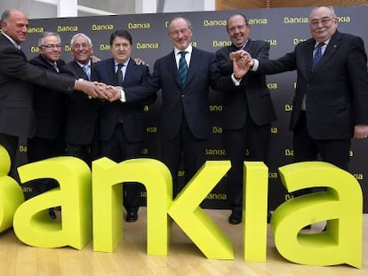 Caja Madrid Chairman Rodrigo Rato (center) in March 2011 with the chiefs of the six other savings banks which made up Bankia. Just over a year after it would be nationalized