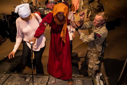 British Nationals seen here boarding an RAF aircraft in Akrotiri, Cyprus, after being evacuated from Sudan