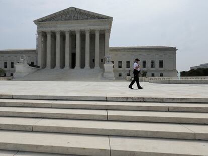 A police officer patrols outside the U.S. Supreme Court in Washington, June 30, 2023.