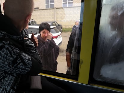 A Russian recruit, back to a camera, looks through a bus window at his mother at a military recruitment center in Volgograd, Russia, Saturday, Sept. 24, 2022. Russian President Vladimir Putin on Wednesday ordered a partial mobilization of reservists to beef up his forces in Ukraine. (AP Photo)