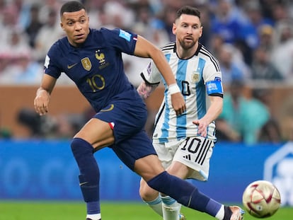 France's Kylian Mbappe and Argentina's Lionel Messi go for the ball during the World Cup final soccer match at the Lusail Stadium in Lusail, Qatar, Sunday, Dec.18, 2022.