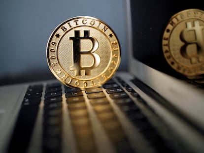 FILE PHOTO: A bitcoin is seen in an illustration picture taken at La Maison du Bitcoin in Paris