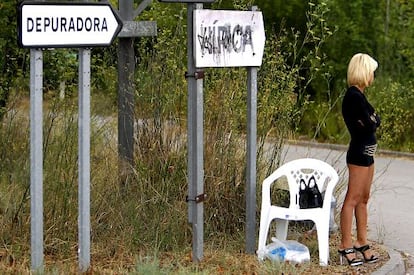 A prostitute waits for clients in Catalonia.