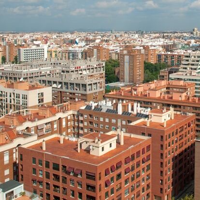 High angle view of Valencia city in bright sunlight under a blue sky with white clouds in summertime, Valencia, Spain.