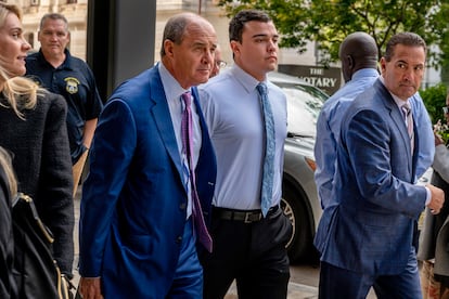 Philadelphia police Officer Mark Dial, center, arrives at the Juanita Kidd Stout Center for Criminal Justice in Philadelphia, on Sept. 19, 202.