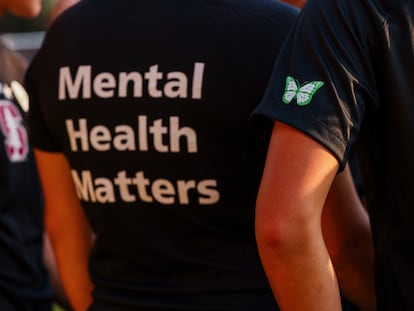 Stanford women's soccer team players wear warmup jerseys with "Mental Health Matters" on their backs as well as a butterfly patch on their sleeves to remember late goalie Katie Meyer, who died by suicide earlier in the year, before an NCAA college soccer match against UCLA, Oct. 14, 2022, in Stanford, Calif.