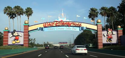 In this file photo taken on July 11, 2020, visitors drive past a sign welcoming them to Walt Disney World on the first day of reopening of the iconic Magic Kingdom theme park in Orlando, Florida.