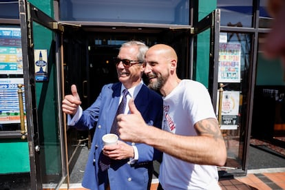 Reform UK party leader Nigel Farage poses for a photo with a supporter in Clacton-on-Sea on Thursday.