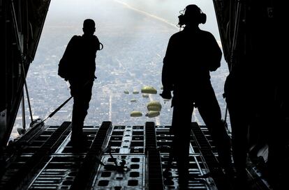 Members of the Jordanian armed forces drop aid parcels over Gaza on April 9.