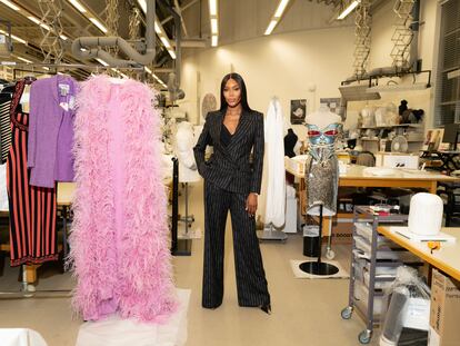 Naomi Campbell with some of the dresses that will be shown in the exhibition dedicated to her at the Victoria & Albert Museum in London.