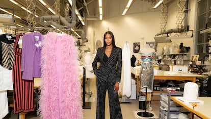 Naomi Campbell with some of the dresses that will be shown in the exhibition dedicated to her at the Victoria & Albert Museum in London.