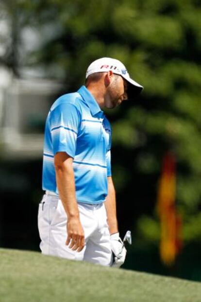 Sergio García reacts after a shot on the first hole during the third round of the 2012 Masters.