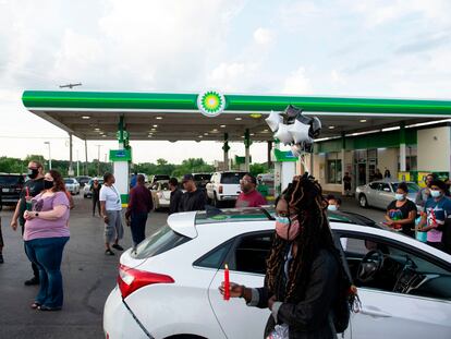 Members of the community gather for a vigil in Kansas City, Missouri, on June 2, 2021, at the BP gas station where Malcolm Johnson was shot and killed by police on March 25.
