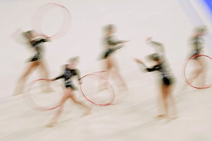 The team from Spain performs their hoop exercise in the rhythmic gymnastics group all-round qualification round at La Chapelle Arena at the 2024 Summer Olympics, Friday, Aug. 9, 2024, in Paris, France. (AP Photo/Charlie Riedel)