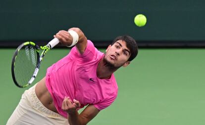 Carlos Alcaraz of Spain serves to Daniil Medvedev of Russia in the men's final at the 2023 ATP Indian Wells Open on March 19, 2023 in Indian Wells, California.