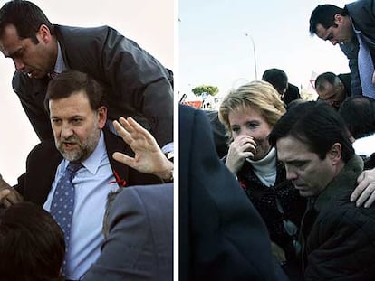 Los escoltas ayudan a Mariano Rajoy y a Esperanza Aguirre a salir del helicóptero, en el que se habían quedado atrapados tras el accidente.