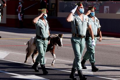 Members of La Legión with a goat, the elite unit's mascot, during the military parade for Spain’s National Day.