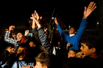 Palestinians react as they wait for news of a ceasefire deal with Israel, in Khan Younis in southern Gaza, January 15, 2025.