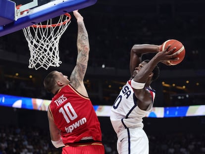 Anthony Edwards of the U.S. in action with Germany's Daniel Theis.