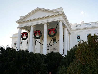 The White House is adorned with Christmas wreaths during a media preview of the "Magic, Wonder and Joy" theme holiday decorations at the White House in Washington, U.S., November 27, 2023.