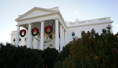 The White House is adorned with Christmas wreaths during a media preview of the "Magic, Wonder and Joy" theme holiday decorations at the White House in Washington, U.S