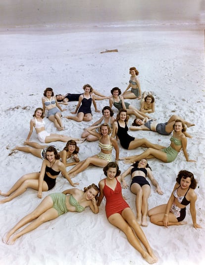 Fashion pic: circa 1950's. A scene on an American beach with young women wearing the up to the minute swimming fashions of the era.