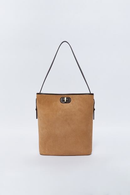 Sfera offers a sure bet with this stylish suede-effect bag with contrasting black touches. Perfect to wear with everything. €32.99.

