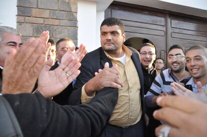 Said Chramti, "The Giant," is greeted by followers on leaving the police station in Nador last month.