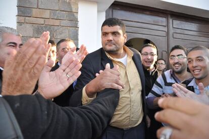 Said Chramti, &quot;The Giant,&quot; is greeted by followers on leaving the police station in Nador last month.