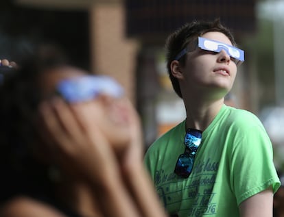 People gather on the campus of Texas-Rio Grande Valley during the  "ring of fire" eclipse of the sun on Saturday Oct. 13, 2023 in Edinburg, Texas. 