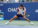 Carlos Alcaraz, of Spain, returns a serve against Peter Gojowczyk, of Germany, during the fourth round of the U.S. Open tennis championships, Sunday, Sept. 5, 2021, in New York. (AP Photo/Frank Franklin II)