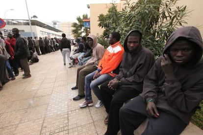 Immigrants who made it over the Melilla border fence, pictured at the police station.