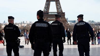 French police and French gendarmes patrol at the Trocadero square near the Eiffel Tower in Paris, France, March 4, 2024