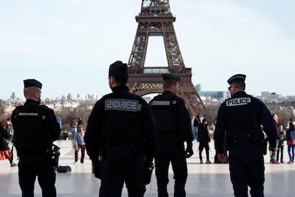 French police and French gendarmes patrol at the Trocadero square near the Eiffel Tower in Paris, France, March 4, 2024