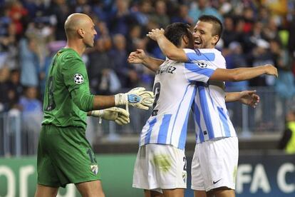 Málaga players Caballero, Jesús Gámez and Ignacio Camacho celebrate the team's 1-0 win over Milan.