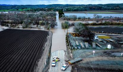 Floodwaters cover South Davis Rd. near Salinas in Monterey County, Calif., as the Salinas River overflows its banks on Friday, Jan. 13, 2023.