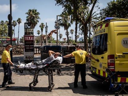 Paramedics help a patient into an ambulance during a heat wave in Barcelona, Spain, on Monday, July 18, 2022. The heat wave killed 360 people dead in Spain between July 10 and 15, Instituto de Salud Carlos III said on Saturday. Photographer: Angel Garcia/Bloomberg