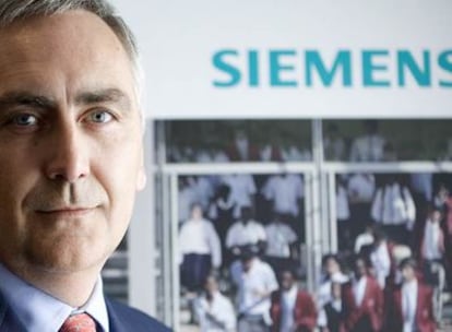 Peter Löscher, presidente y consejero delegado de Siemens, confía en aprovechar la crisis para hacer más competitivo al gigante de la ingeniería europea.