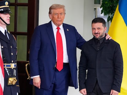 President Donald Trump, left, greets Ukraine's President Volodymyr Zelenskyy as he arrives at the White House, Monday, Aug. 18, 2025, in Washington. (AP Photo/Alex Brandon)