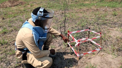 João Eduardo points out a mine, inside a security perimeter, in the town of Libolo, in central Angola, at the end of August.