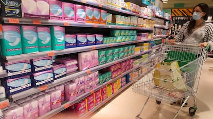 Products related to menstruation and feminine hygiene in a supermarket.