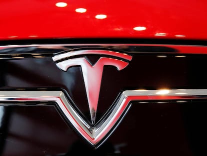 FILE PHOTO: A Tesla logo on a Model S is photographed inside of a Tesla dealership in New York