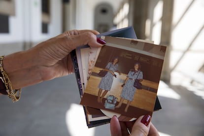 Isabel Almazán holds pictures of herself in the uniform she wore at the time the painting was brought back to Spain.