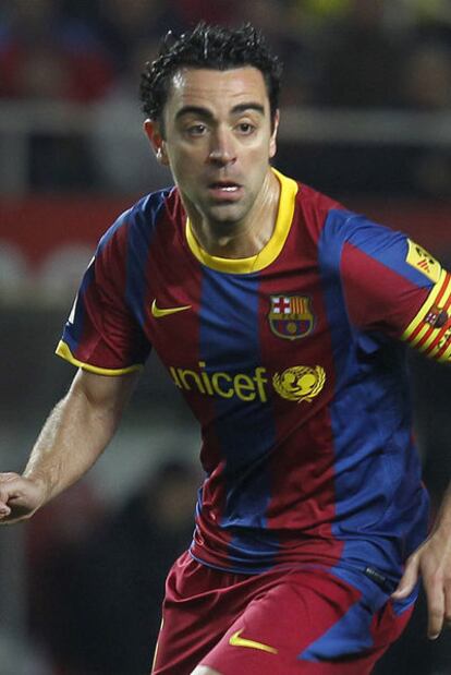 Xavi, en un encuentro contra el Sevilla.