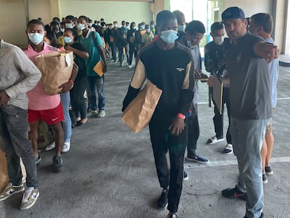 Oceanside City Councilman Eric Joyce helps orient asylum-seekers who have just been released by U.S. Customs and Border Protection in the city of Oceanside, California. October 12, 2023.