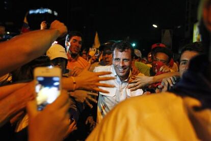 Venezuela presidential candidate Henrique Capriles greets supporters during a campaign rally in Caracas on April 1.