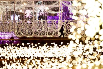 A passerby walks next to light-up decorations of the annual Sapporo White Illumination event in Sapporo, northern Japan, November 24, 2016. REUTERS/Issei Kato